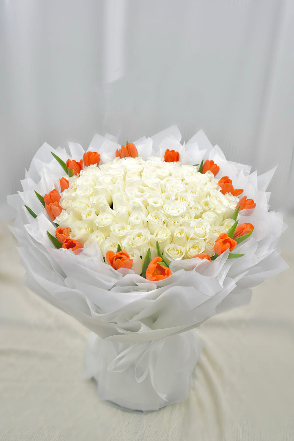 Premium White Roses Served With Tulips